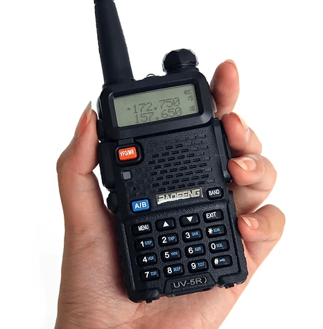 New amateur radio operator holding - handheld ham radio antenna Baofeng UV-5R handheld transceiver with stock rubber duck antenna